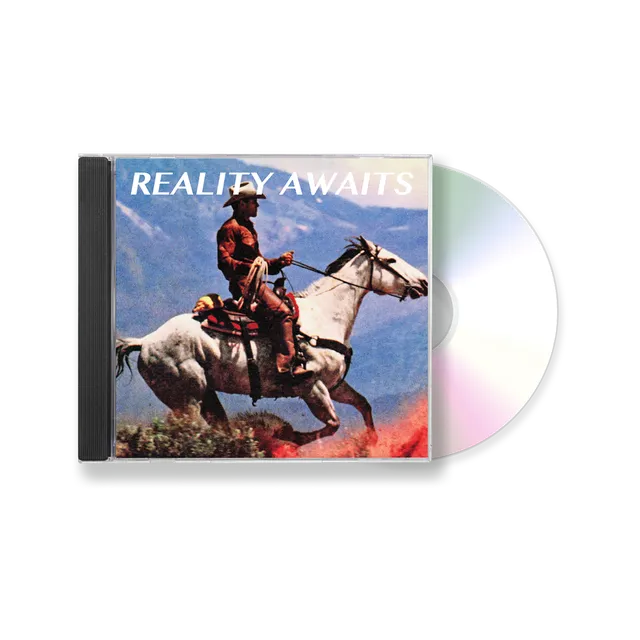 Pochette de l'album Reality Awaits de The Strokes : un cowboy sur un cheval au galop devant des montagnes
